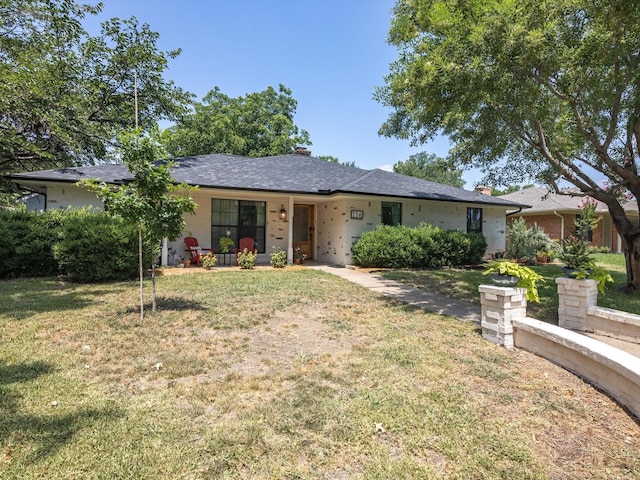 ranch-style home with a front lawn