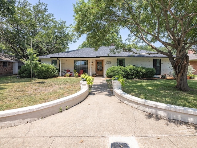 ranch-style house with a front lawn