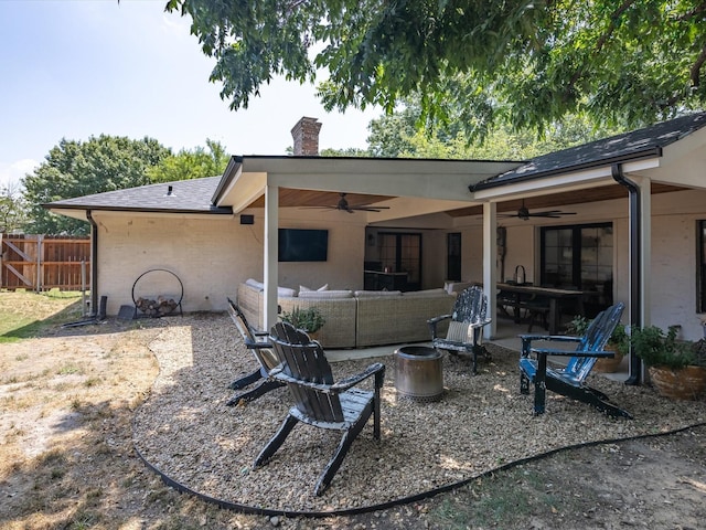 rear view of property with an outdoor hangout area, a patio, and ceiling fan