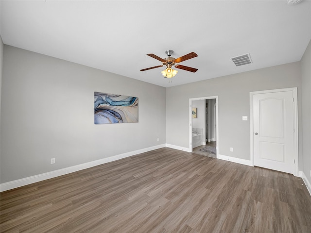 unfurnished room featuring hardwood / wood-style flooring and ceiling fan