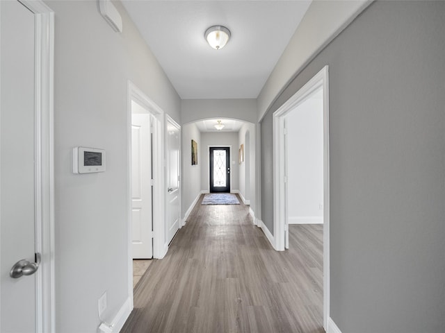 hall with light hardwood / wood-style floors