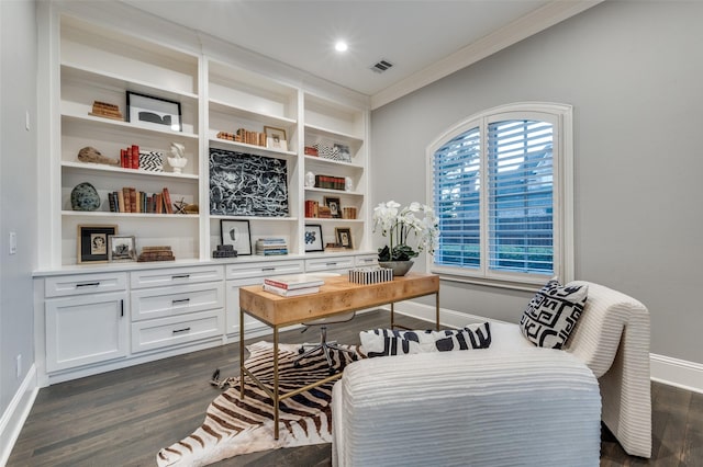 office featuring built in shelves, ornamental molding, and dark hardwood / wood-style floors