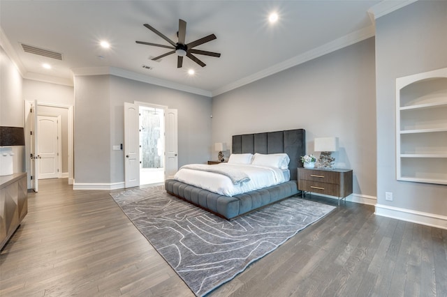 bedroom featuring crown molding, dark wood-type flooring, and ceiling fan