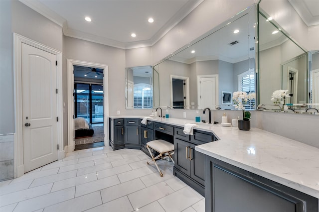 bathroom featuring vanity, tile patterned flooring, ornamental molding, and ceiling fan