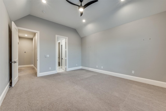 unfurnished bedroom with lofted ceiling, light colored carpet, and ceiling fan