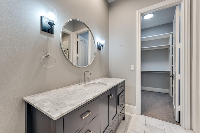 bathroom with vanity and tile patterned flooring