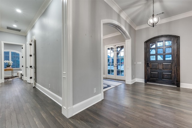 entrance foyer featuring crown molding, dark hardwood / wood-style floors, and french doors