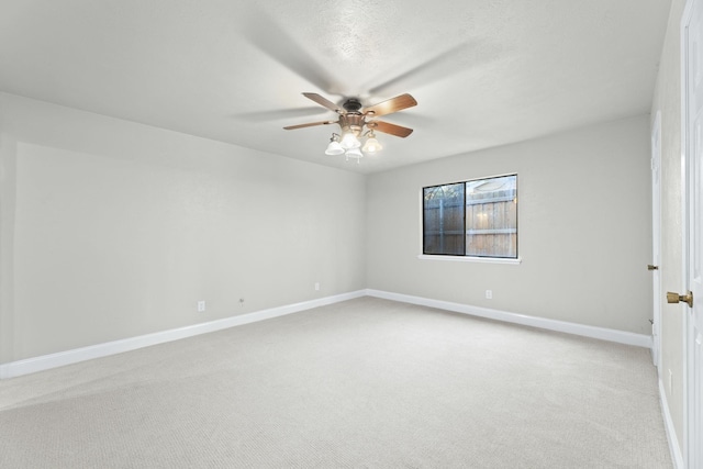 unfurnished room with light carpet, a textured ceiling, and ceiling fan