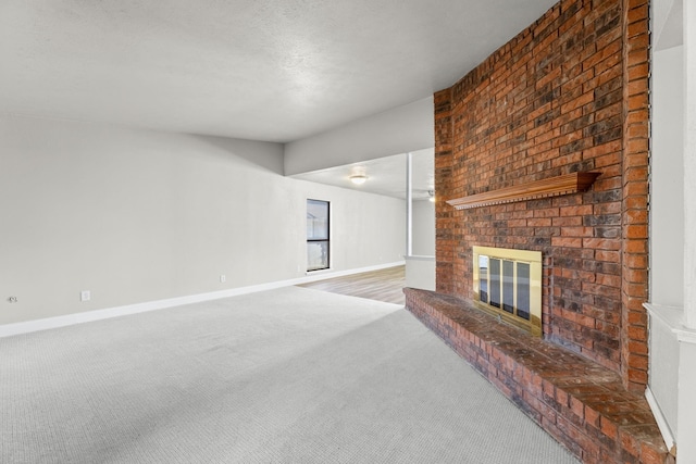 unfurnished living room with a fireplace and carpet floors