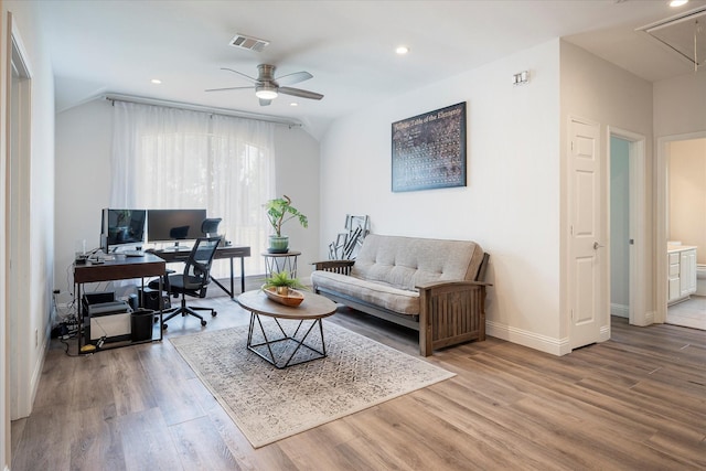 home office with hardwood / wood-style floors, vaulted ceiling, and ceiling fan