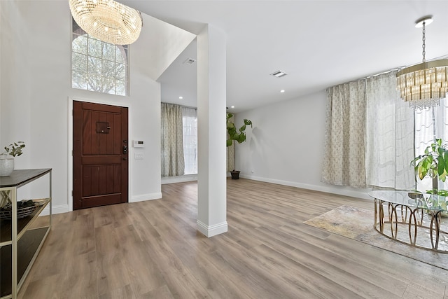 foyer featuring plenty of natural light and light wood-type flooring