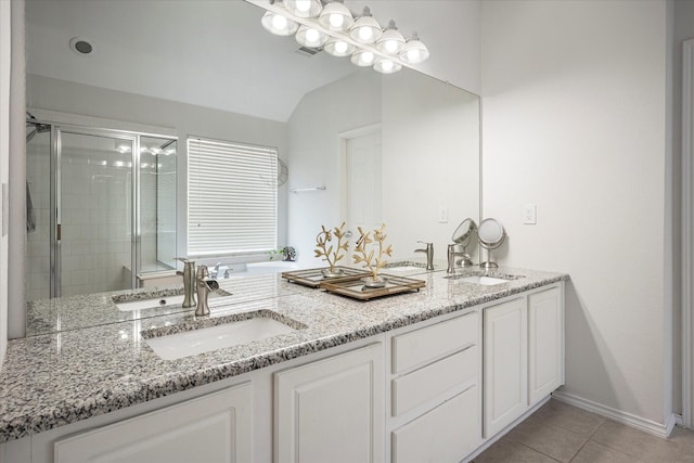 bathroom with vanity, tile patterned floors, and walk in shower