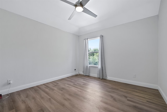 empty room featuring wood-type flooring and ceiling fan