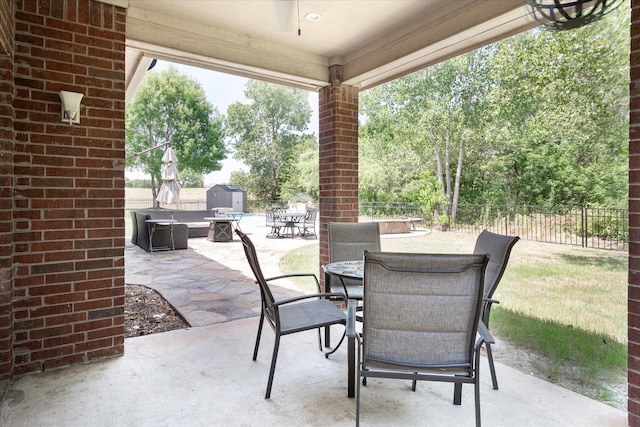 view of patio with a storage unit