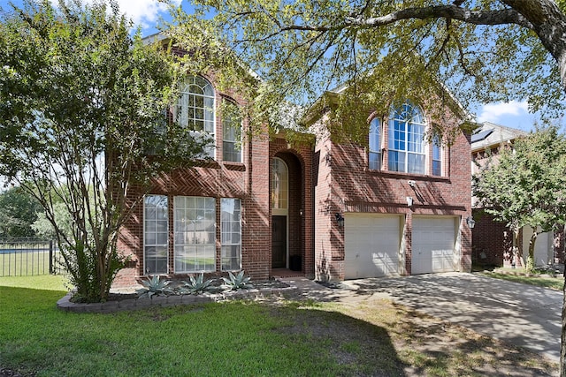 view of front facade with a garage and a front yard