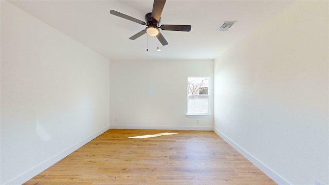 unfurnished room featuring ceiling fan and light hardwood / wood-style flooring