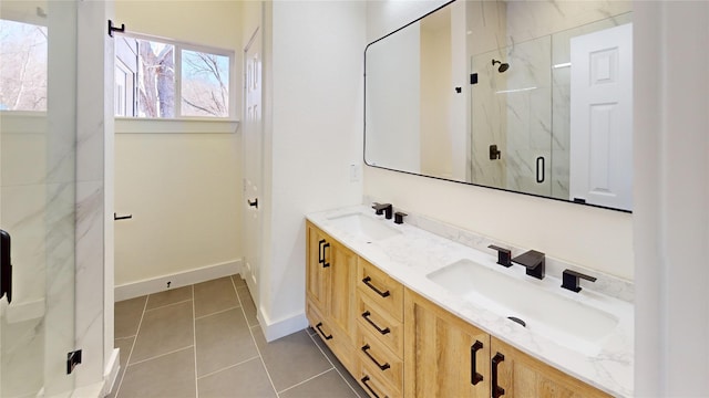 bathroom with tile patterned floors, vanity, and a shower with shower door