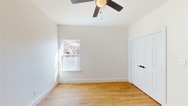 unfurnished bedroom with light hardwood / wood-style flooring and ceiling fan