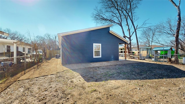 view of side of home featuring central air condition unit