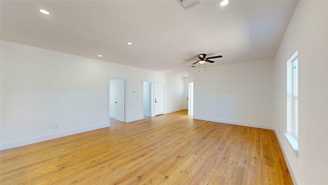 spare room featuring ceiling fan and light hardwood / wood-style floors