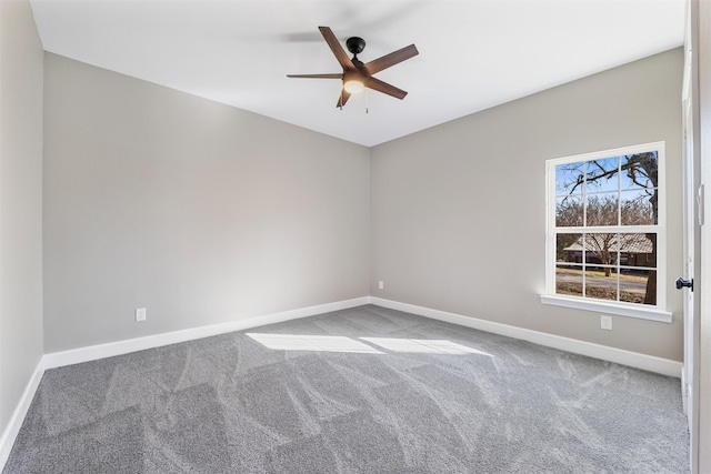 spare room featuring carpet floors and ceiling fan