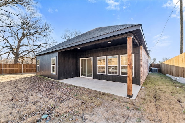 rear view of house featuring central AC and a patio