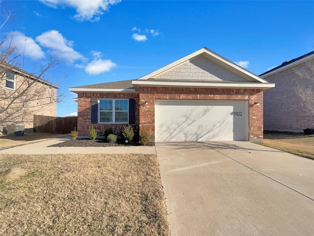 single story home with a garage and a front yard