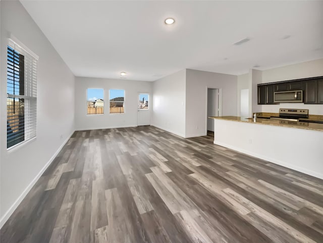 unfurnished living room featuring dark hardwood / wood-style floors