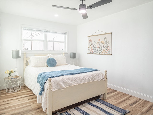 bedroom featuring hardwood / wood-style flooring and ceiling fan