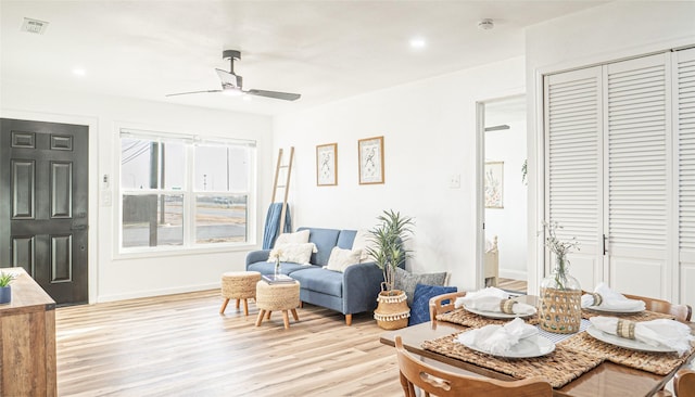 sitting room featuring ceiling fan and light hardwood / wood-style floors