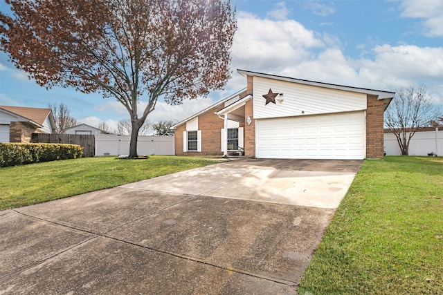 view of front of property featuring a garage and a front yard