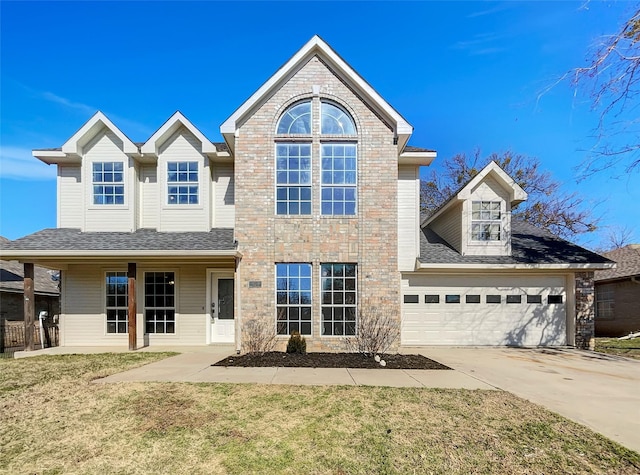 front facade featuring a garage and a front yard