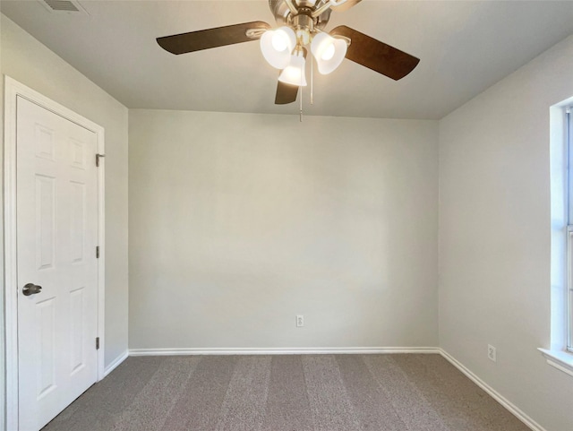 carpeted empty room with a healthy amount of sunlight