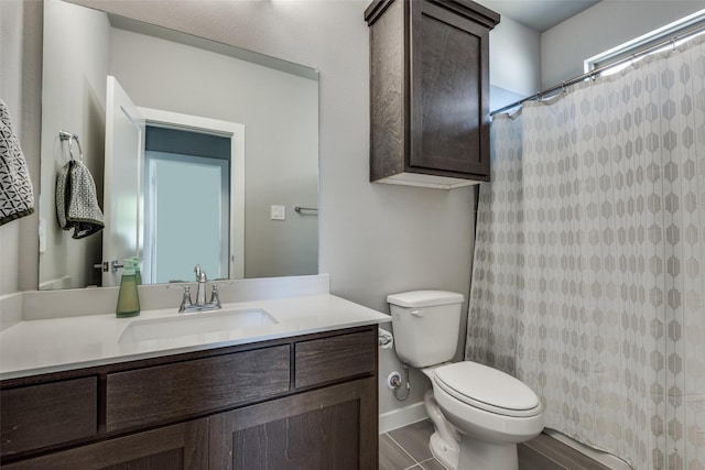 bathroom with vanity, toilet, and a shower with shower curtain