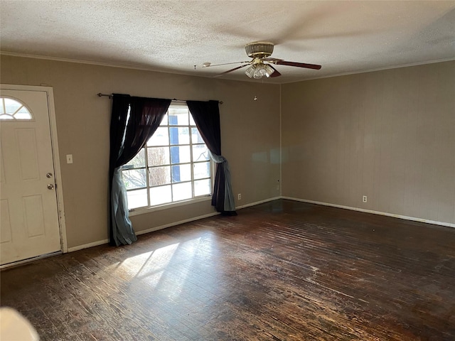 foyer featuring dark wood-type flooring, ceiling fan, crown molding, and a textured ceiling