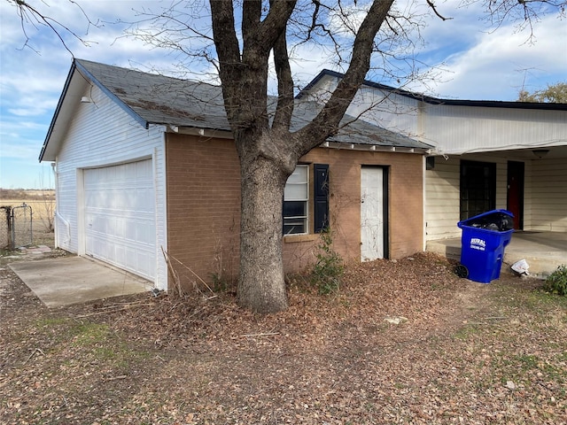 view of side of property with a garage