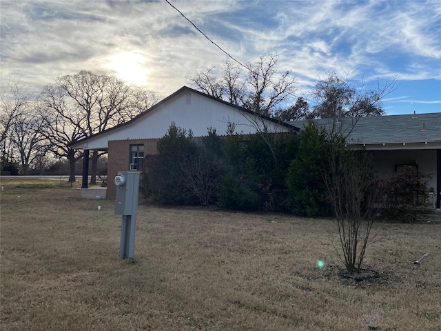 view of property exterior with a yard