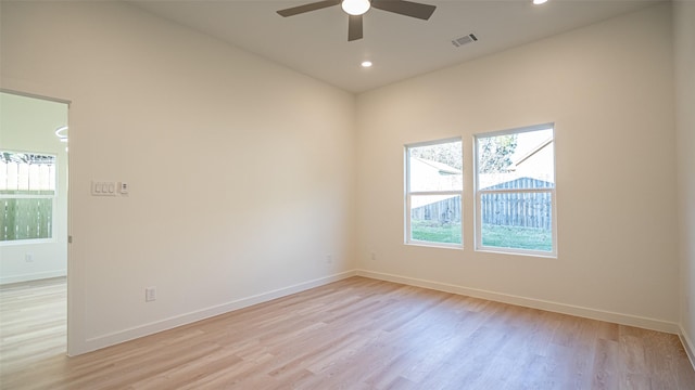 unfurnished room with ceiling fan and light hardwood / wood-style flooring