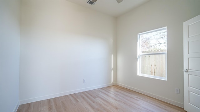 unfurnished room with ceiling fan and light hardwood / wood-style flooring