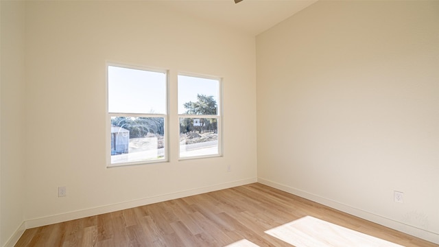 empty room with light hardwood / wood-style flooring