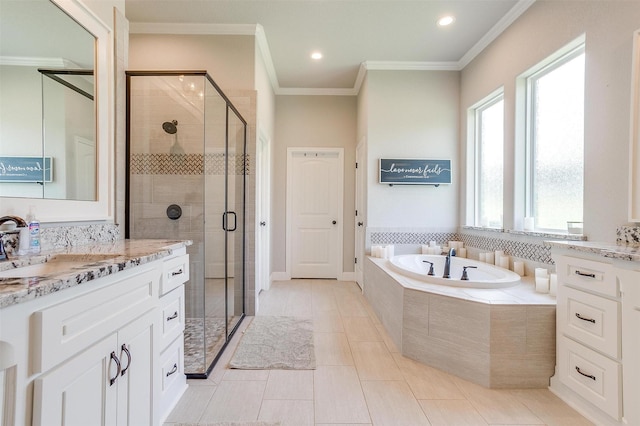 bathroom with ornamental molding, shower with separate bathtub, vanity, and tile patterned floors