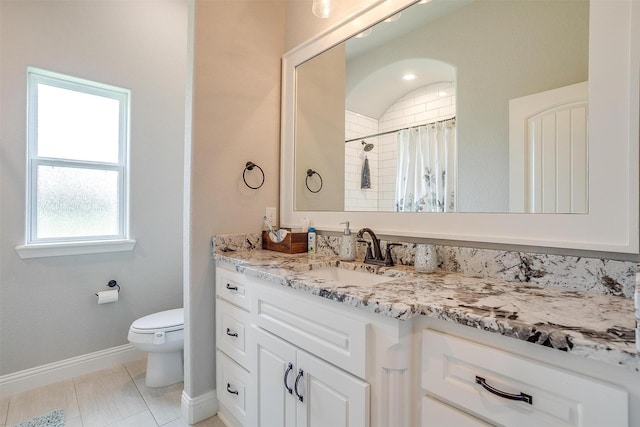 bathroom with vanity, a shower with curtain, tile patterned floors, and toilet