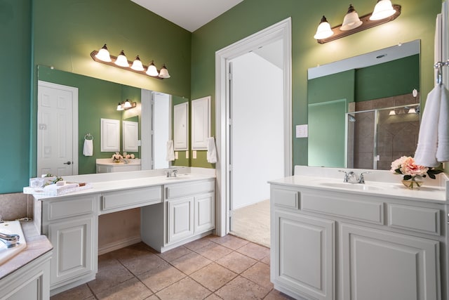 bathroom featuring tile patterned flooring, vanity, and an enclosed shower