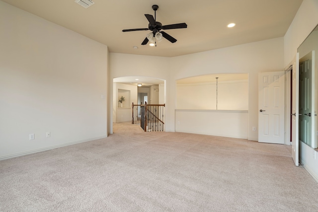 unfurnished room featuring light carpet and ceiling fan