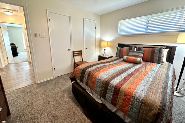 bedroom with carpet floors and a textured ceiling