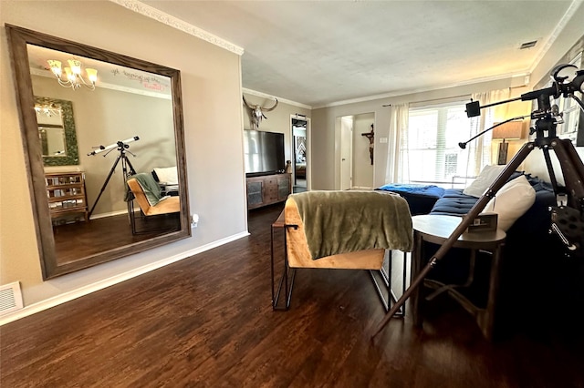 dining room with dark wood-type flooring, crown molding, and an inviting chandelier