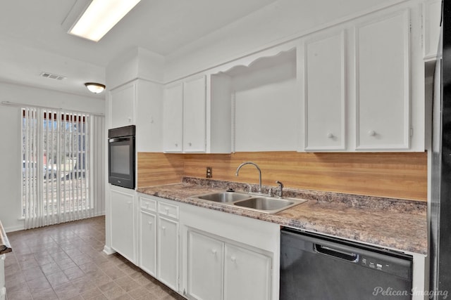 kitchen with sink, dishwasher, white cabinetry, wall oven, and tasteful backsplash