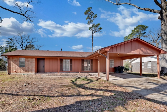 ranch-style home featuring a carport