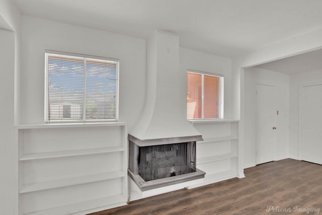 unfurnished living room with dark hardwood / wood-style flooring