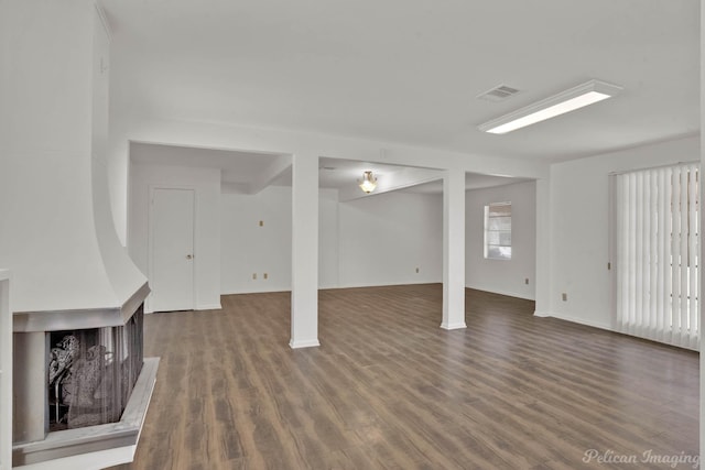 basement with hardwood / wood-style flooring